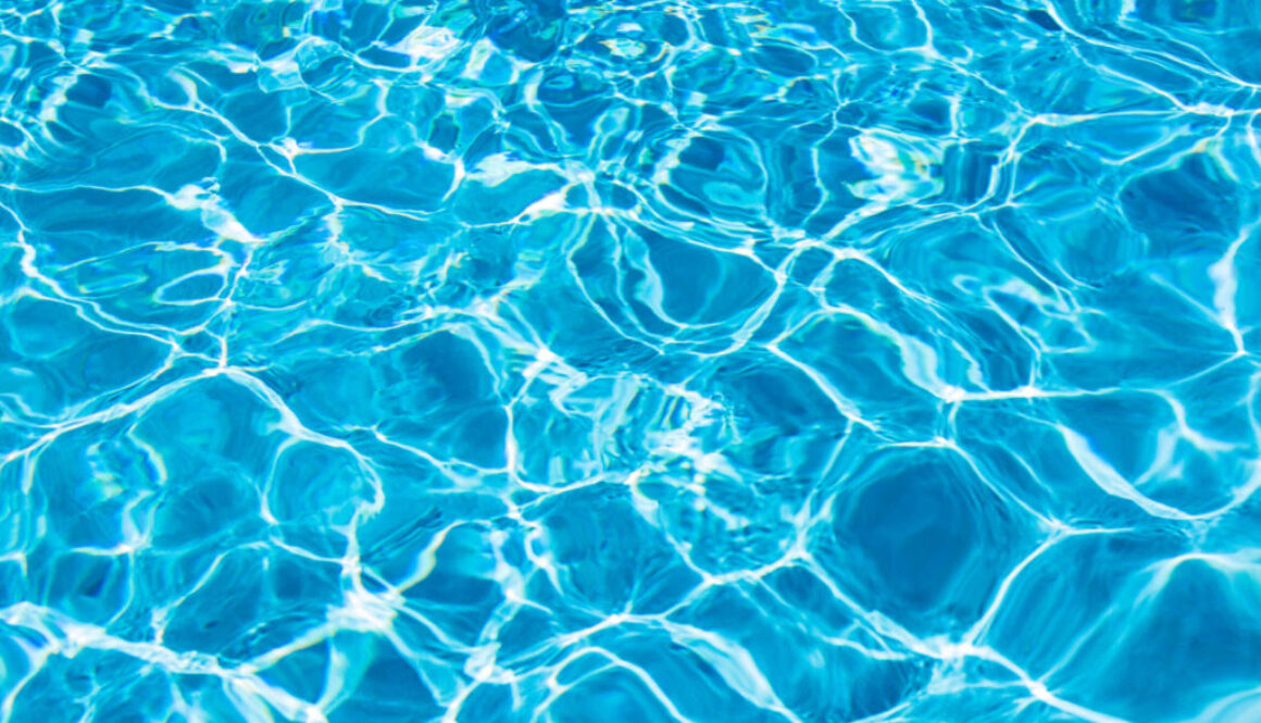 Clear blue water in swimming pool