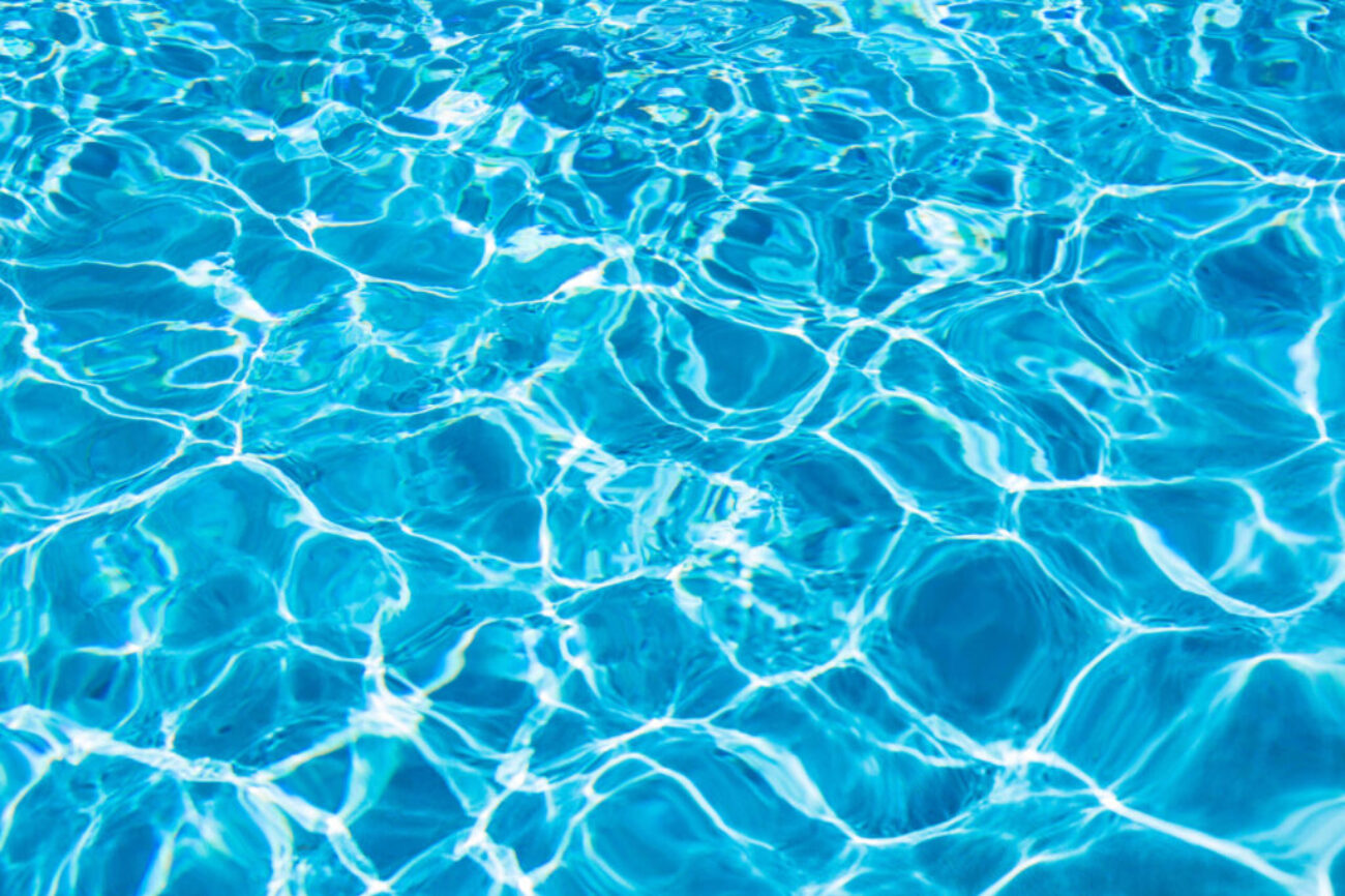 Clear blue water in swimming pool