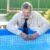 Handsome man in business suit by the pool