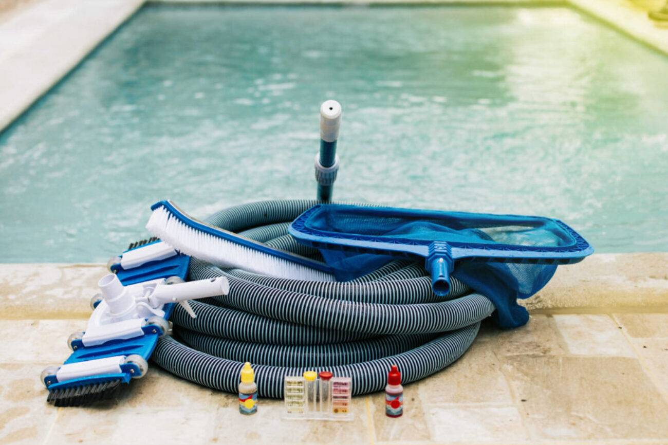 Pool cleaning and maintenance tools, image of pool cleaning and maintenance kit, vacuum cleaner, ph test, leaf picker and pool sweeper