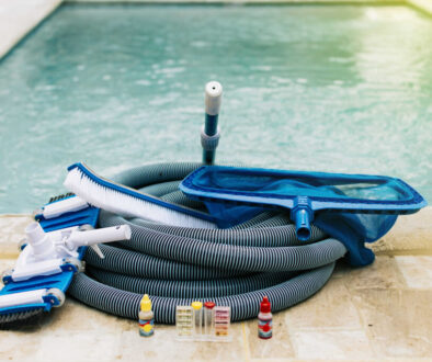 Pool cleaning and maintenance tools, image of pool cleaning and maintenance kit, vacuum cleaner, ph test, leaf picker and pool sweeper