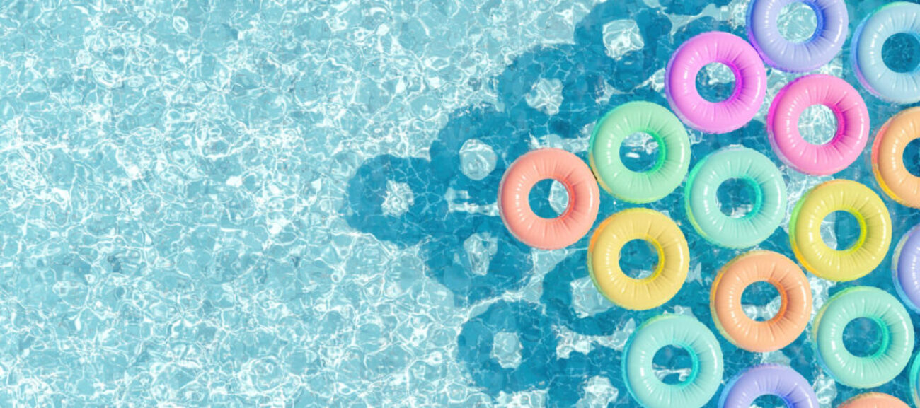 swimming pool seen from above with many rings floating