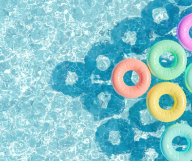 swimming pool seen from above with many rings floating