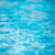 Tansparent clear calm water surface texture. Abstract nature background. Sea water pattern.