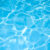 Blue and bright water surface and ripple wave with sun reflectio