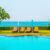sun-beds-umbrellas-around-swimming-pool_0x800
