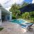 backyard-modern-house-with-swimming-pool-artificial-grass-stone-path-trees-chairs(3)_0x800