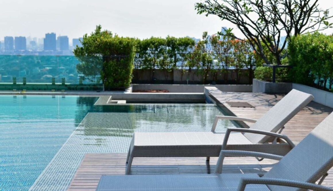 Swimming pool on roof top with beautiful city view at bangkok, t