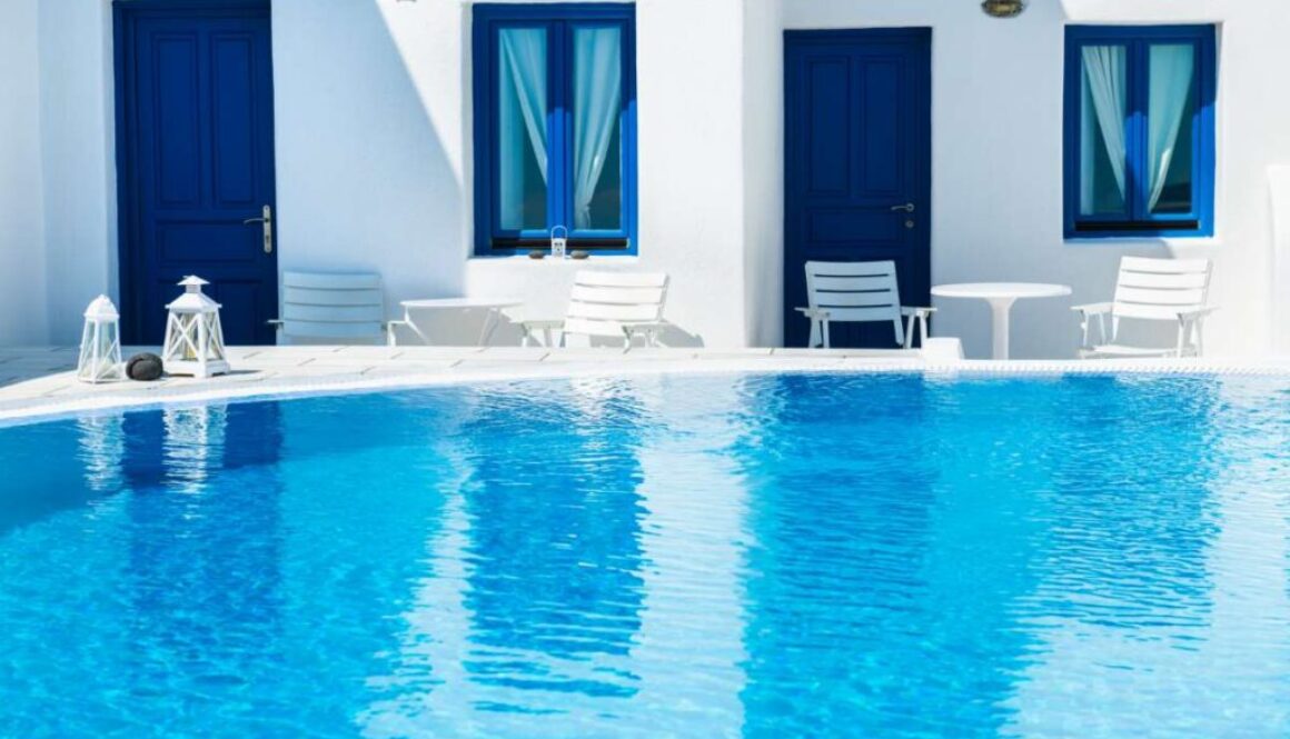 luxury-swimming-pool-with-blue-water-hotel-santorini-island-greece_0x800