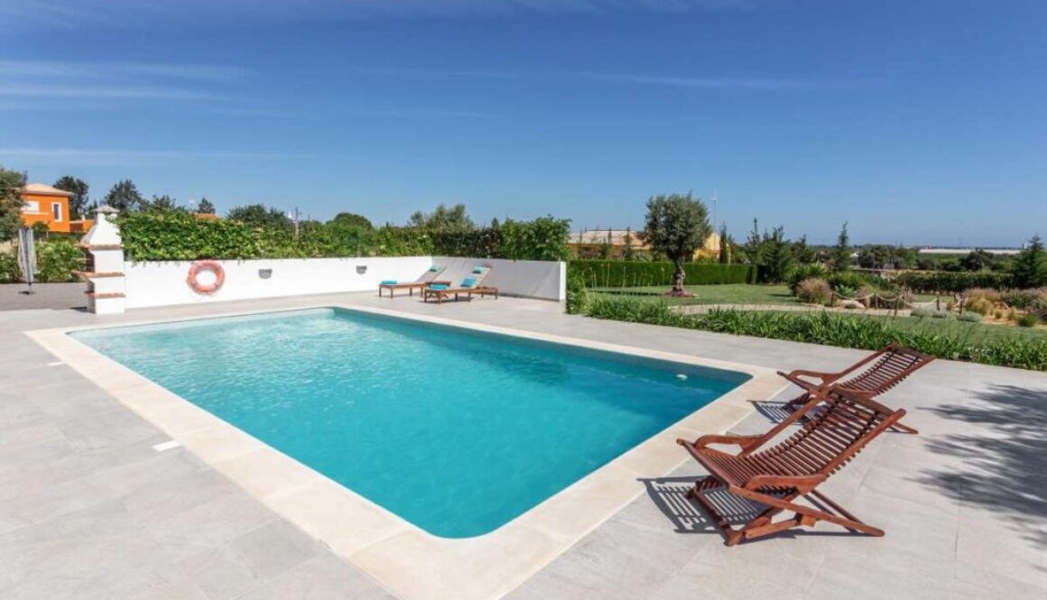 Sun bath with sun loungers and parasol. In Portugal.