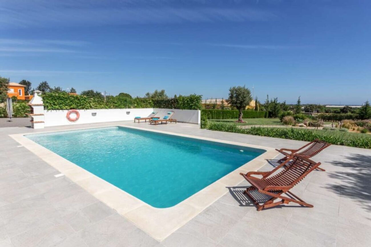 Sun bath with sun loungers and parasol. In Portugal.