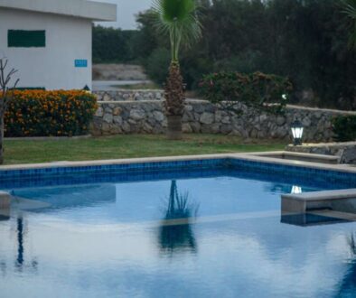 swimming pool near a house in a residential complex at sunset 3