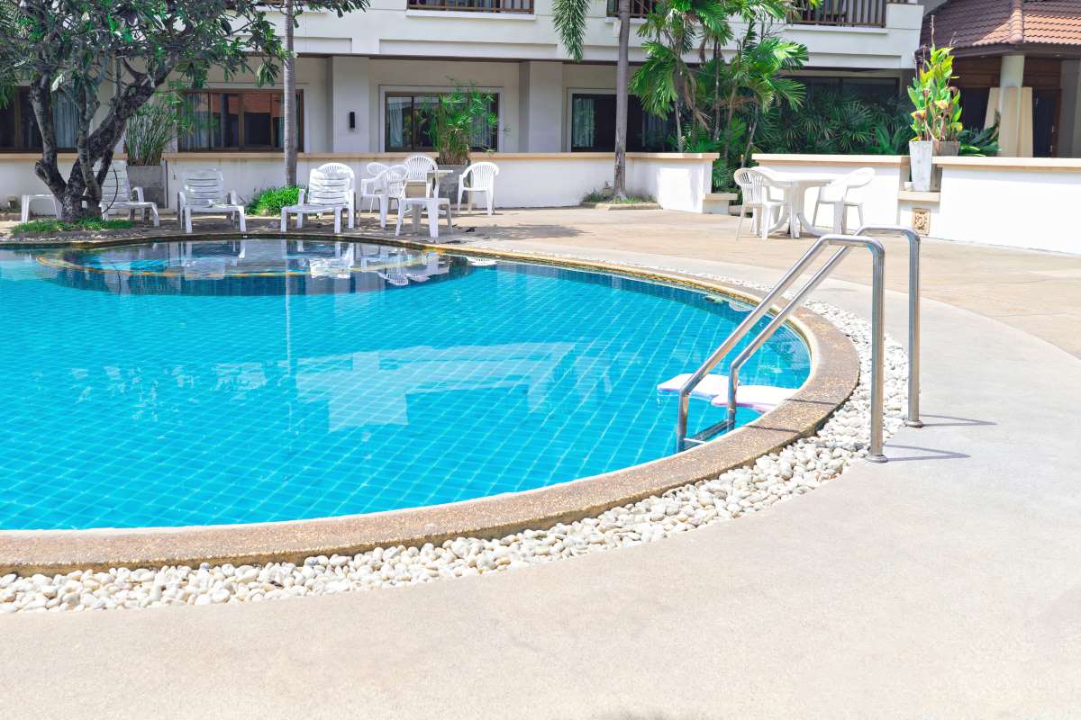 swimming pool with grab bars ladder