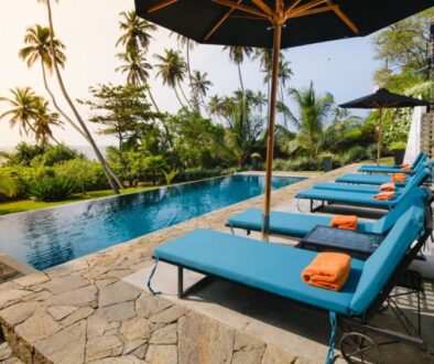 Swimming pool and lounge chairs in boutique hotel, Sri Lanka