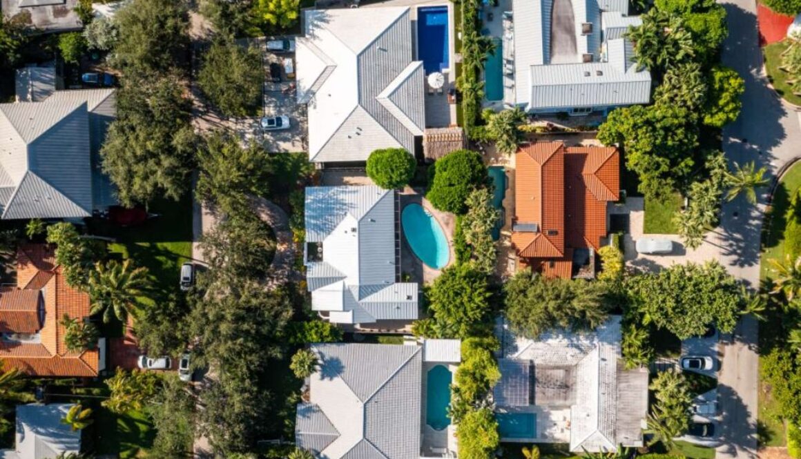 aerial-drone-photoshoot-commercial-area-luxury-houses-beach-with-turquoise-water-sky-canal_0x800