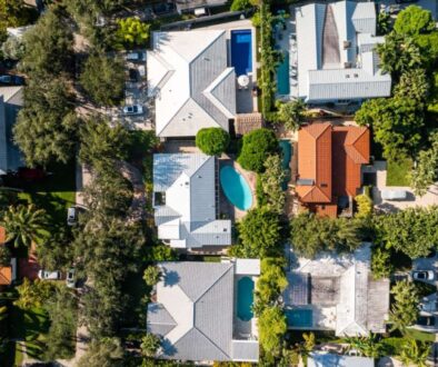 aerial-drone-photoshoot-commercial-area-luxury-houses-beach-with-turquoise-water-sky-canal_0x800