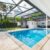 backyard-modern-house-with-swimming-pool-artificial-grass-stone-path-trees-chairs(3)_0x800