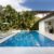 backyard-modern-house-with-swimming-pool-artificial-grass-stone-path-trees-chairs(4)_0x800