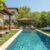 beautifully-landscaped-backyard-with-swimming-pool-sun-loungers-shaded-outdoor-dining-area-perfect-relaxation-entertainment_0x800