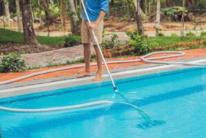 cleaner-swimming-pool-man-blue-shirt-with-cleaning-equipment-swimming-pools-sunny(1)_0x800