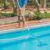 cleaner-swimming-pool-man-blue-shirt-with-cleaning-equipment-swimming-pools-sunny(1)_0x800
