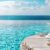 cocktail-pool-deck-its-crystalclear-glass-shimmering-sunlight-against-backdrop-tranquil-blue-waters-evoking-sense-luxury-relaxation_0x800