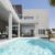 detached-house-with-minimalist-architecture-with-swimming-pool-gardens-with-palm-trees-porch-with-rattan-sofas_0x800