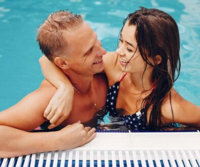 elegant-couple-swim-pool (1)_0x800