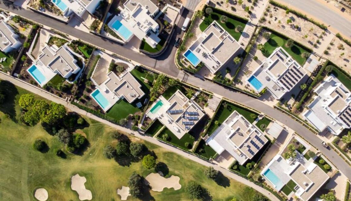 high-angle-view-street-amidst-buildings-town_0x800