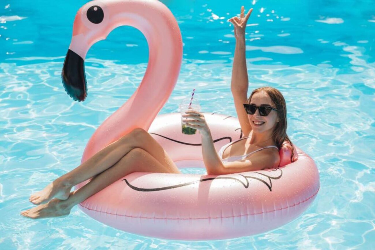 young-woman-relaxing-flamingo-swim-ring_0x800