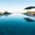 empty-deckchairs-umbrella-arranged-by-swimming-pool-against-clear-blue-sky-nursing-home-copy-space-water-reflection-unaltered-support-assisted-living-retirement-home_0x800