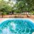 kenya-luxury-swimming-pool-african-garden-with-tipical-local-chairs-made-wood-background_0x800