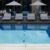 modern-minimalist-aesthetic-swimming-pool-by-capturing-photo-poolside-lounge-area_0x800