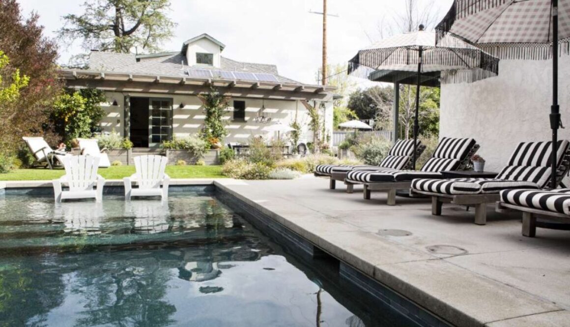 wooden-seats-by-pool-with-parasols_0x800