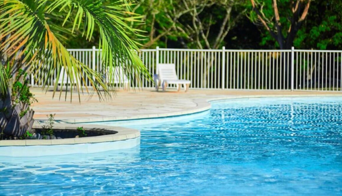 beautiful-swimming-pool-with-clear-blue-water-sunny-summer-day_0x800