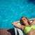 beautiful-young-woman-yellow-glasses-yellow-swimsuit-sunbathing-by-pool-summer_0x800