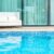 empty-outdoor-patio-chair-near-swimming-pool_0x800