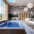 interior-pool-indoors-oriental-style-spa-complex-swimming-pool-lined-with-blue-white-ceramic-tiles-3d-rendering_0x800