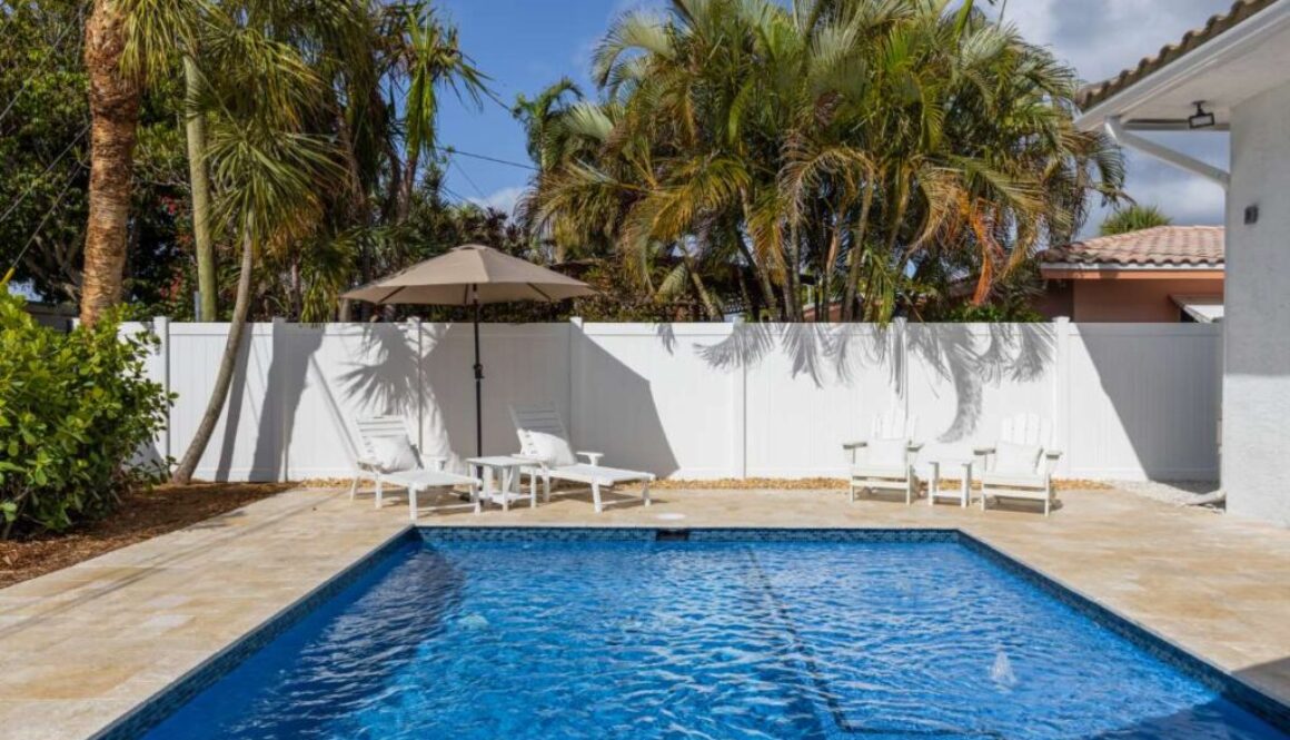 modern-building-with-swimming-pool-trees-chairs-landscape-with-blue-sky-scenic-enviroment(1)_0x800