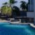 relaxing-afternoon-by-tranquil-poolside-surrounded-by-palm-trees-sunny-day_0x800