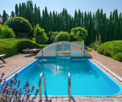 swimming-pool-garden-with-nicely-trimmed-bushes-stones-backyard-landscape-design-high-quality-photo_0x800