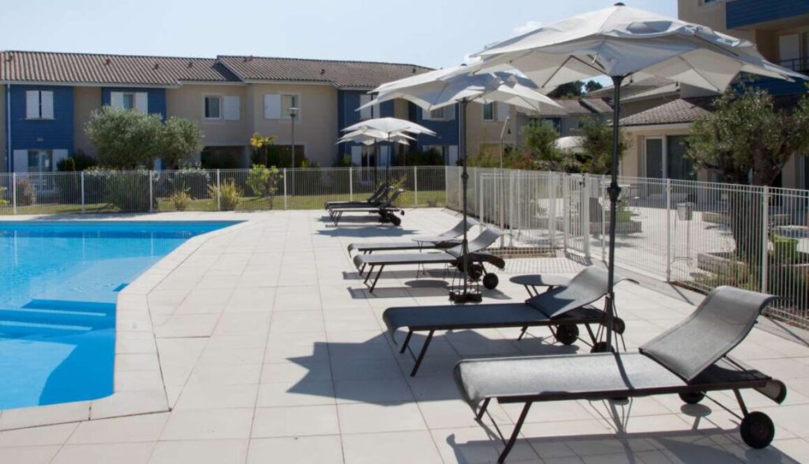 swimming-pool-resort-summer-with-chairs-umbrella_0x800
