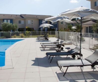 swimming-pool-resort-summer-with-chairs-umbrella_0x800